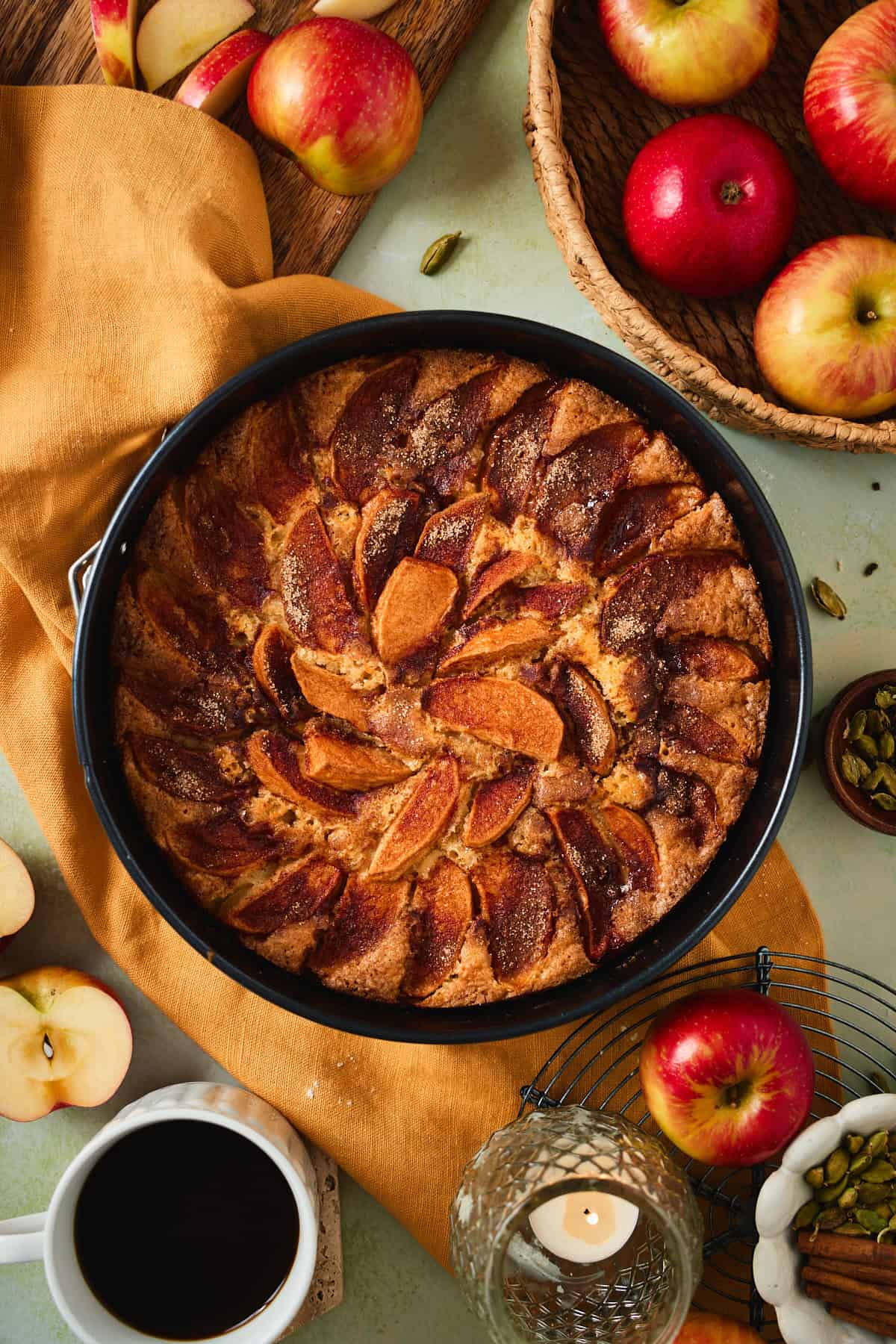 Baked Swedish apple cake with golden apple wedges fanned across the top.