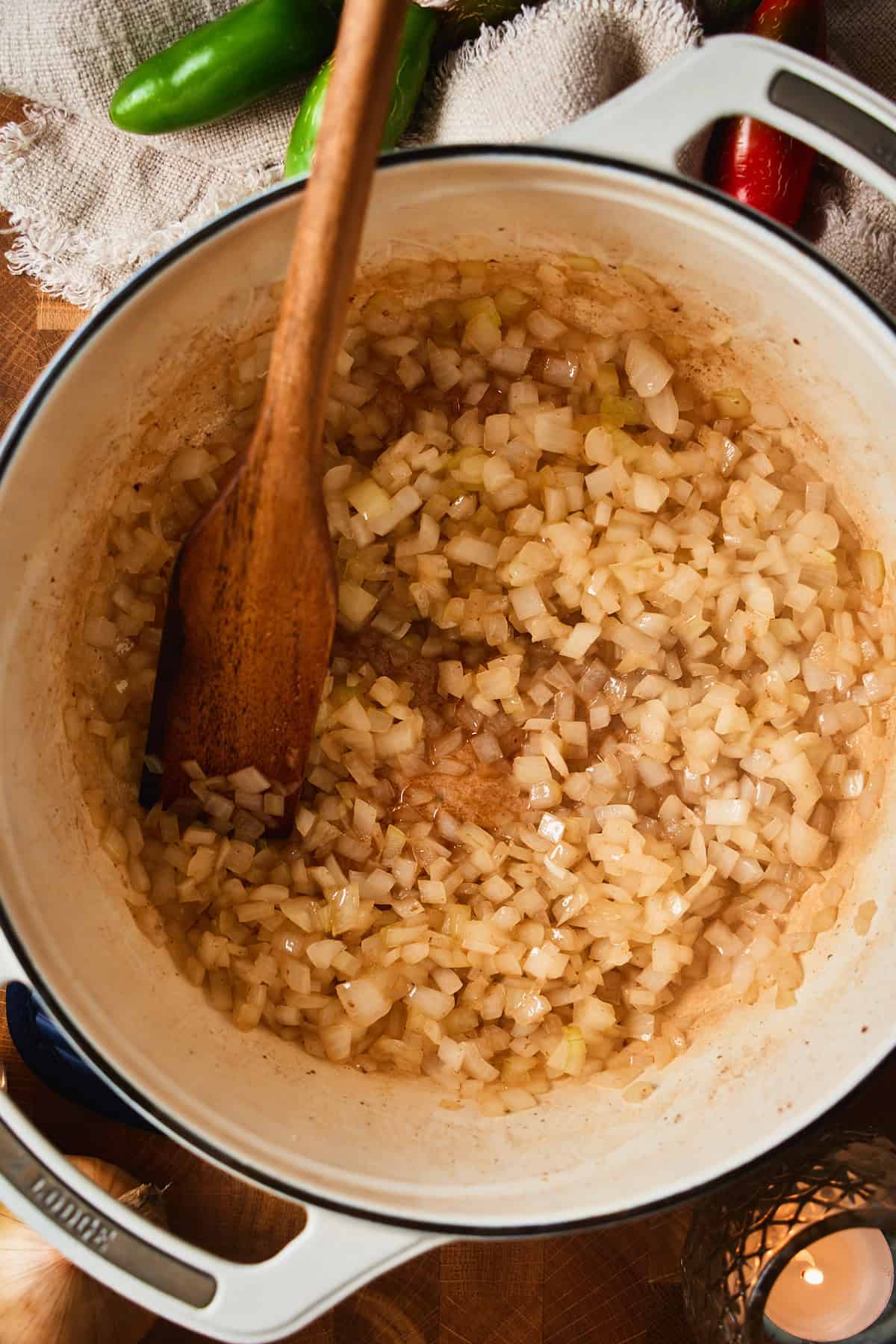 Softened, translucent onions in a Dutch oven.
