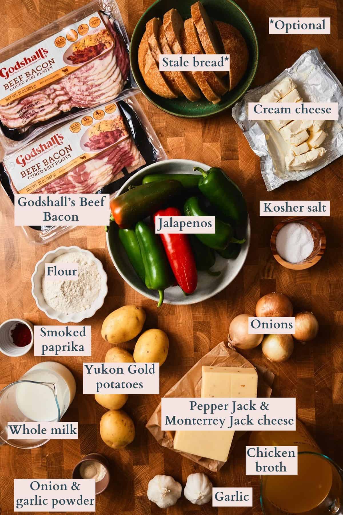Ingredients for jalapeño popper soup, including beef bacon, jalapeños, potatoes, cream cheese, Monterey Jack, pepper jack, and bread.