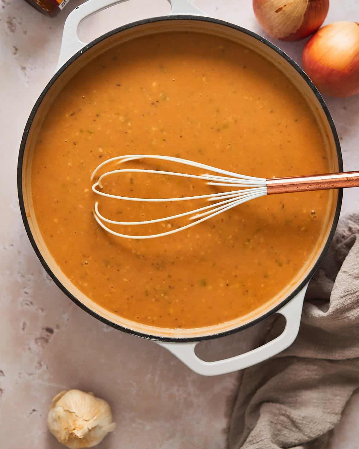 Gravy beginning to form in a skillet.